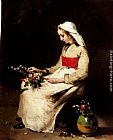 Theodule Augustine Ribot A Girl Arranging A Vase Of Flowers painting